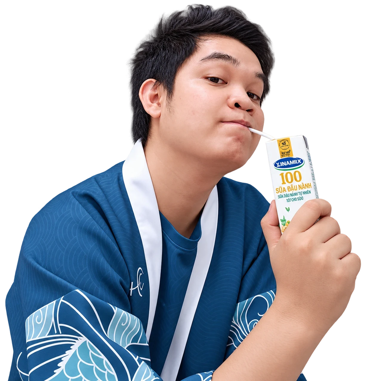 Duong Hoang holding a milk carton and drinking through a straw